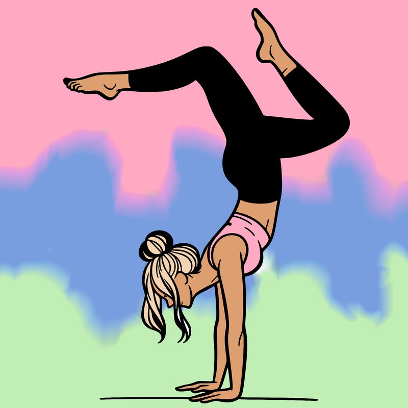 a woman doing a handstand