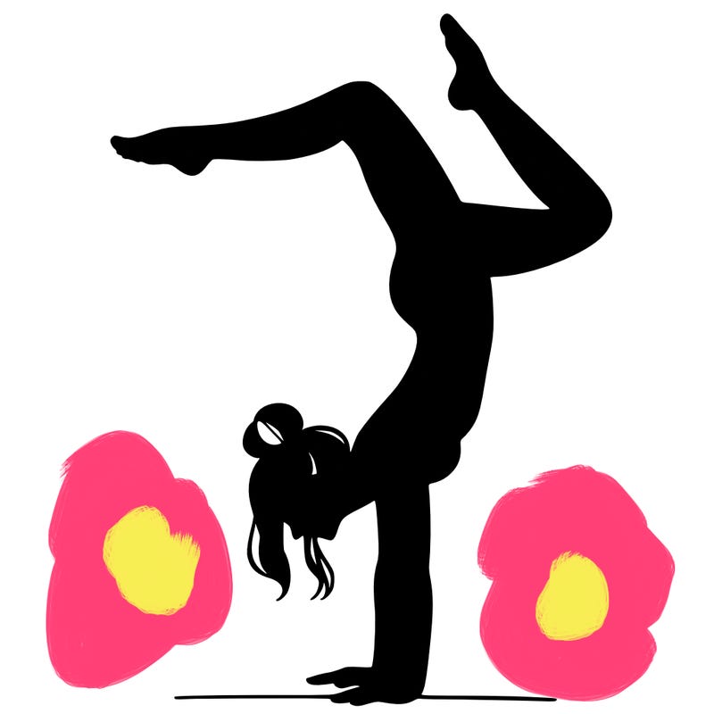 a woman doing a handstand