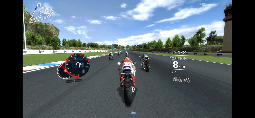 A motorcycle racing on a track in the Real Moto mobile game.