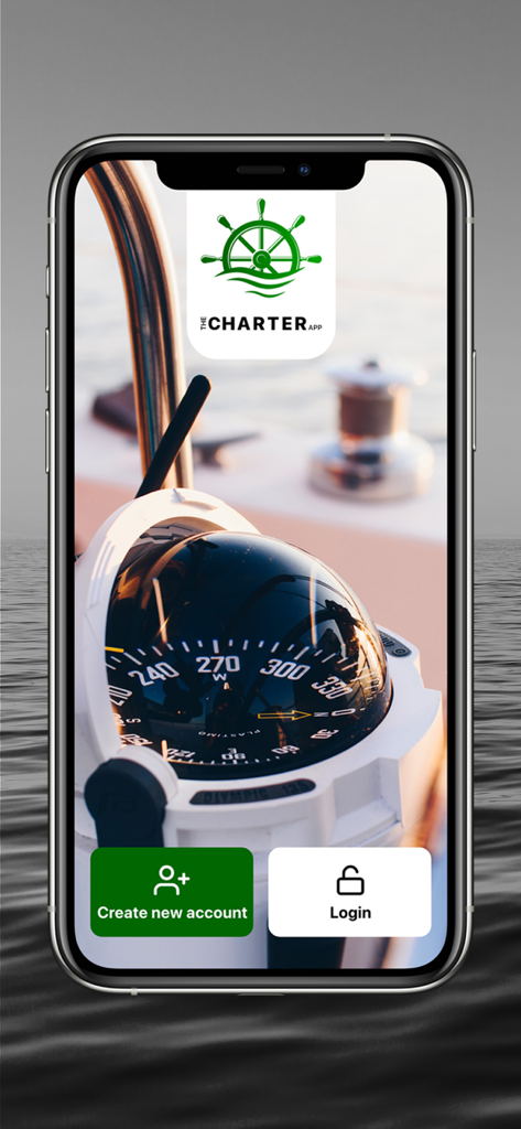 The Charter App - Schermata di accesso di The Charter App con una bussola nautica sul ponte di una barca con pulsanti per creare un account e accedere.