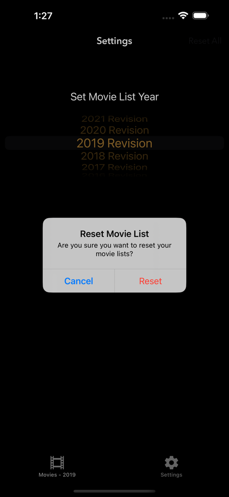 Settings screen of the 1001 Movies app showing a reset movie list alert and a year revision picker.