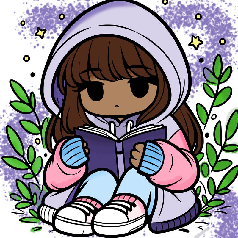 girl in oversized hoodie reading a book