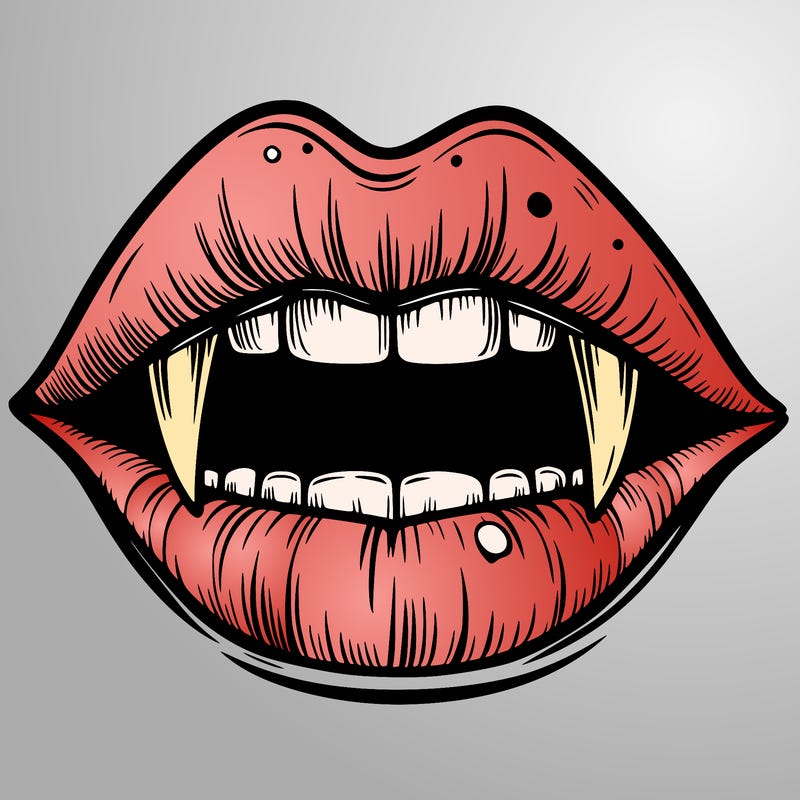 lips with vampire teeth