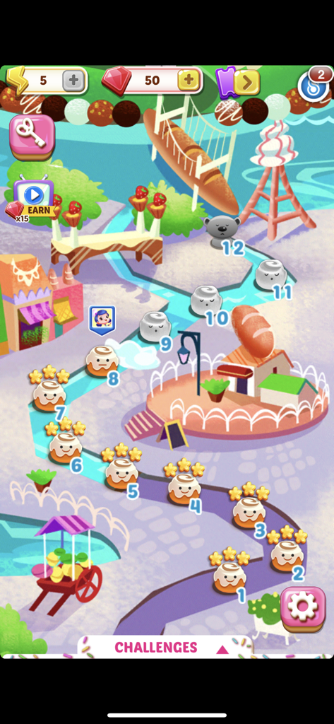 A colorful game map in Cupcake Mania showing numbered levels and a whimsical bakery themed world path
