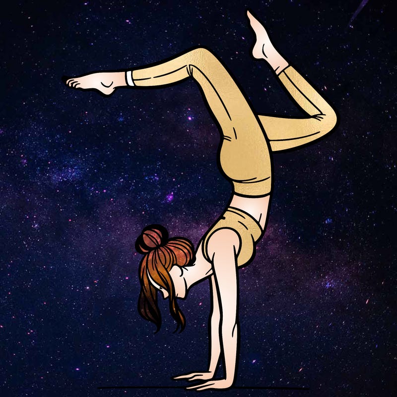 a woman doing a handstand