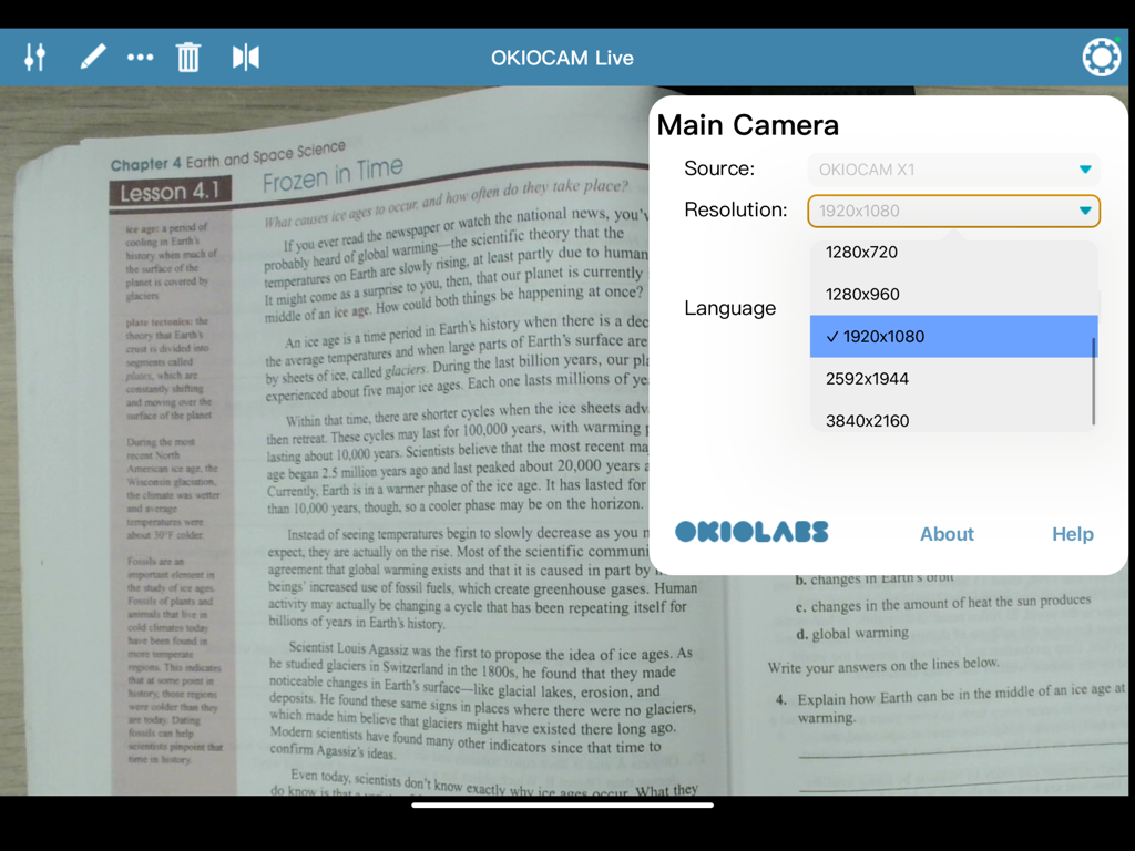 OKIOCAM Live app interface on iPad showing camera resolution selection menu over a textbook
