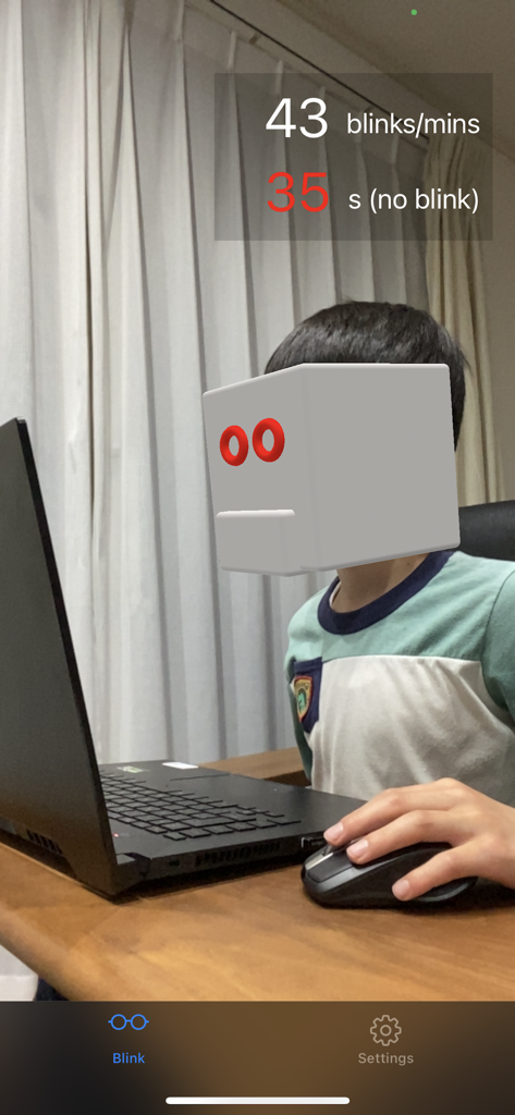 Eyeblinkr - Eyeblinkr app tracking a user's eye blinks per minute while they work on a laptop