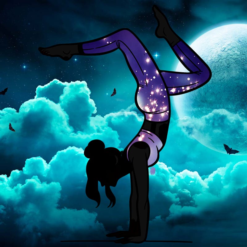 a woman doing a handstand