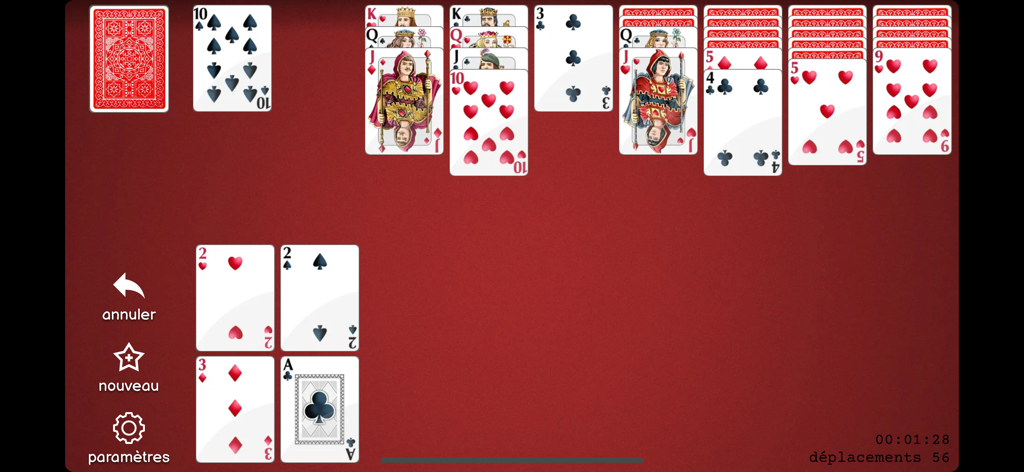 Solitaire - Cards - Interfaz del juego de Solitario Clásico que muestra cartas sobre un fondo rojo con fuentes grandes y legibles