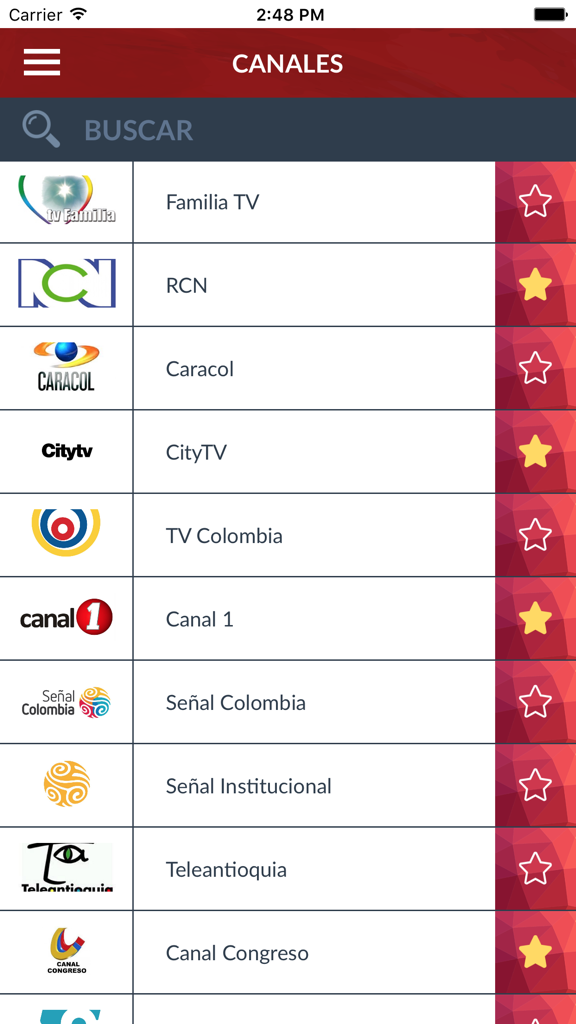Mobile app interface showing a list of Colombian TV channels with logos and favorite options