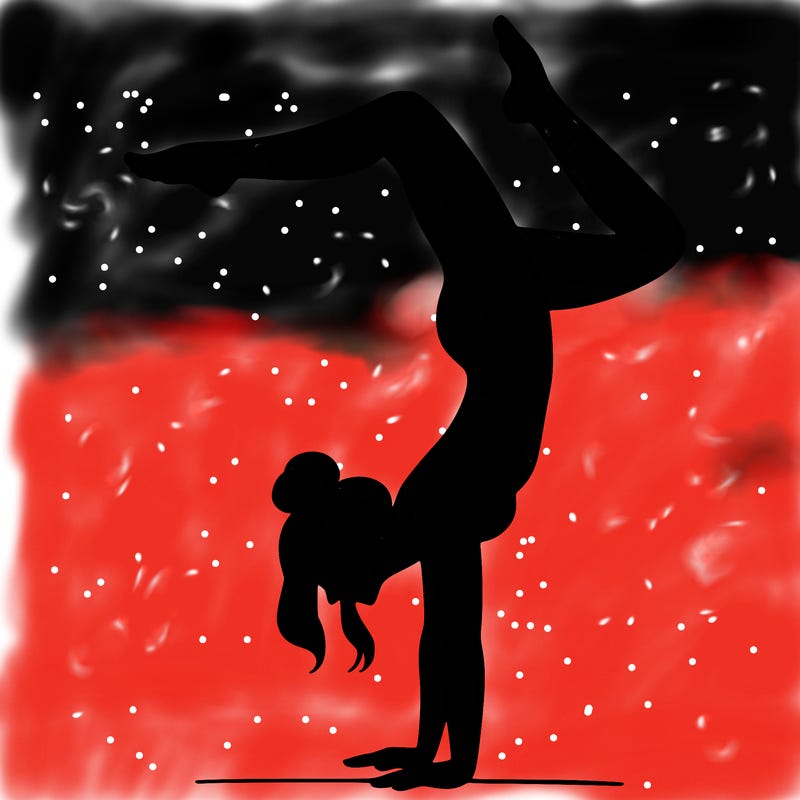 a woman doing a handstand