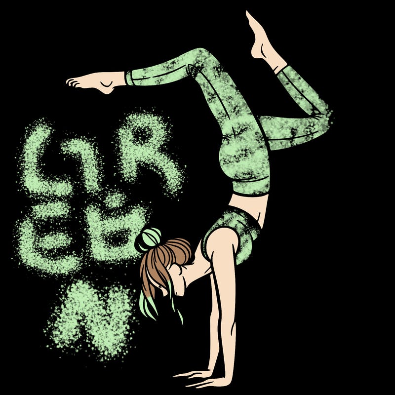 a woman doing a handstand