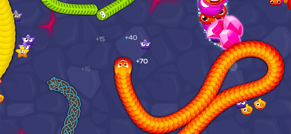 Colorful worms with different skins collecting food and gems in the snake arena