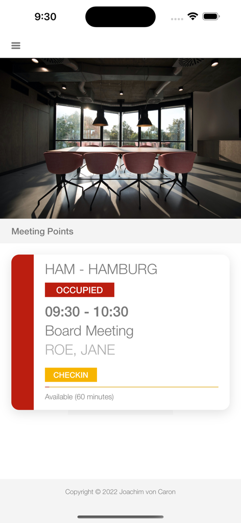 iPhone screen showing an occupied conference room status for a board meeting with a yellow check-in button