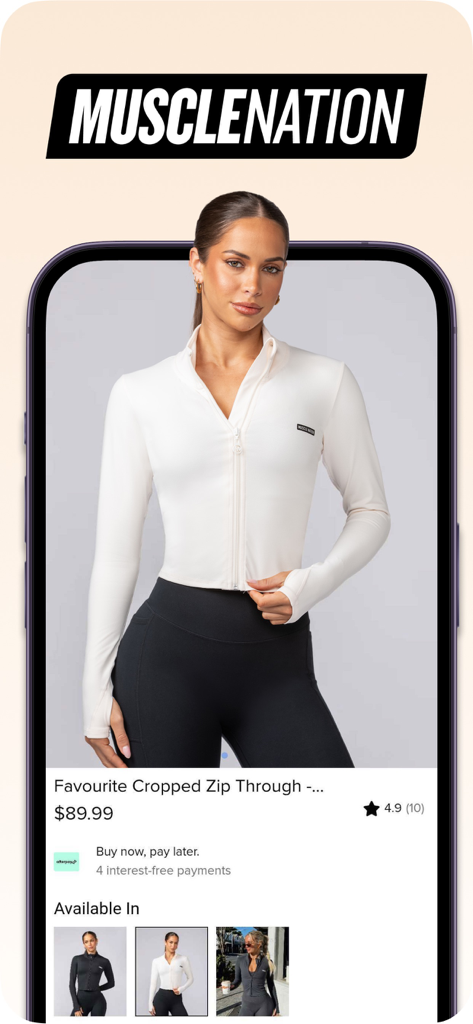 Product page of the Muscle Nation app displaying a white cropped zip through jacket with pricing and ratings
