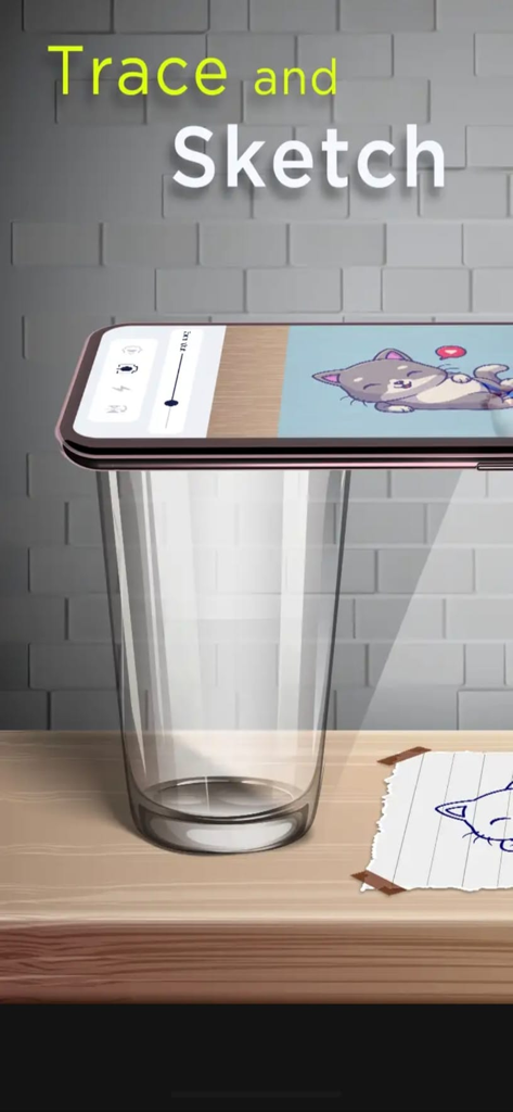 AR Drawing _ Draw Sketch App - Un téléphone sur un support en verre traçant un chat de dessin animé sur du papier à l'aide de l'application de dessin RA.