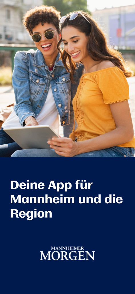 Two women smiling while using a tablet to read local news from the Mannheimer Morgen app