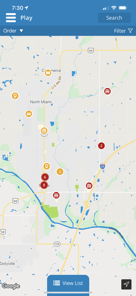 A mobile app interface displaying a map of Miami Oklahoma with various points of interest and Route 66 markers