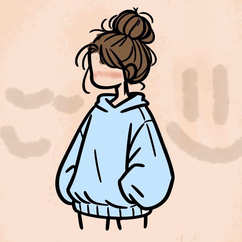 girl with baggy sweatshirt and messy bun