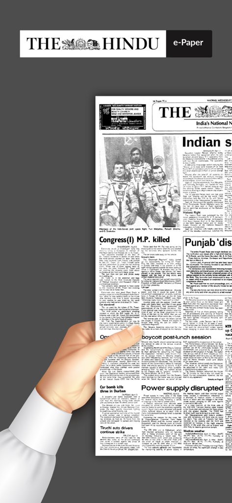 A hand holding a smartphone showing the digital replica of The Hindu newspaper front page