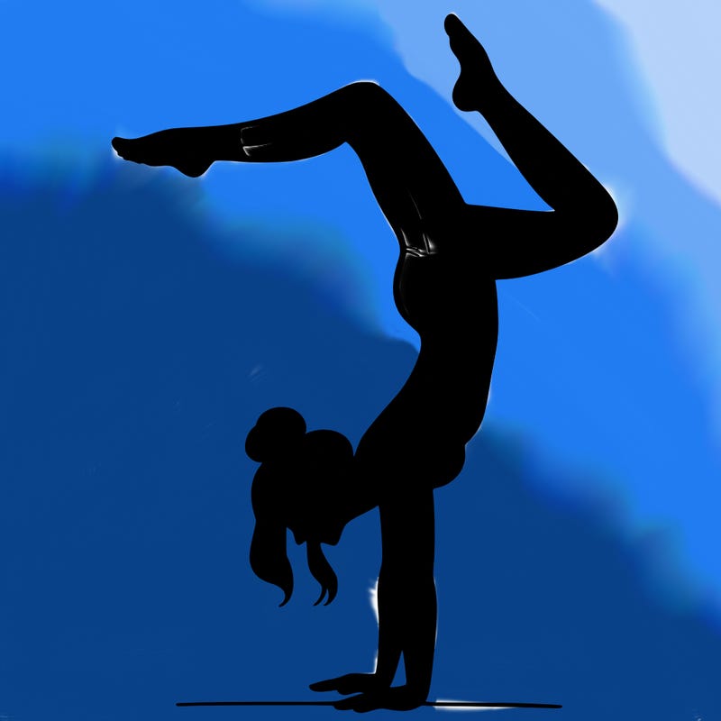 a woman doing a handstand