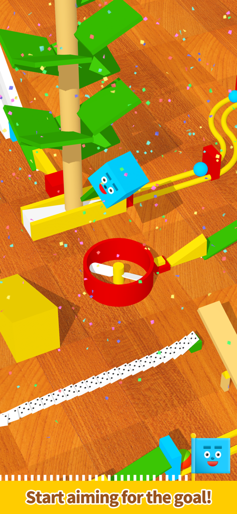 Pocket Marble Runs - 木製の床の上にある、ドミノとコースが設置されたカラフルな3Dマーブルラン