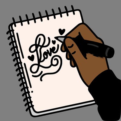 a hand writing “love” in calligraphy on a notebook