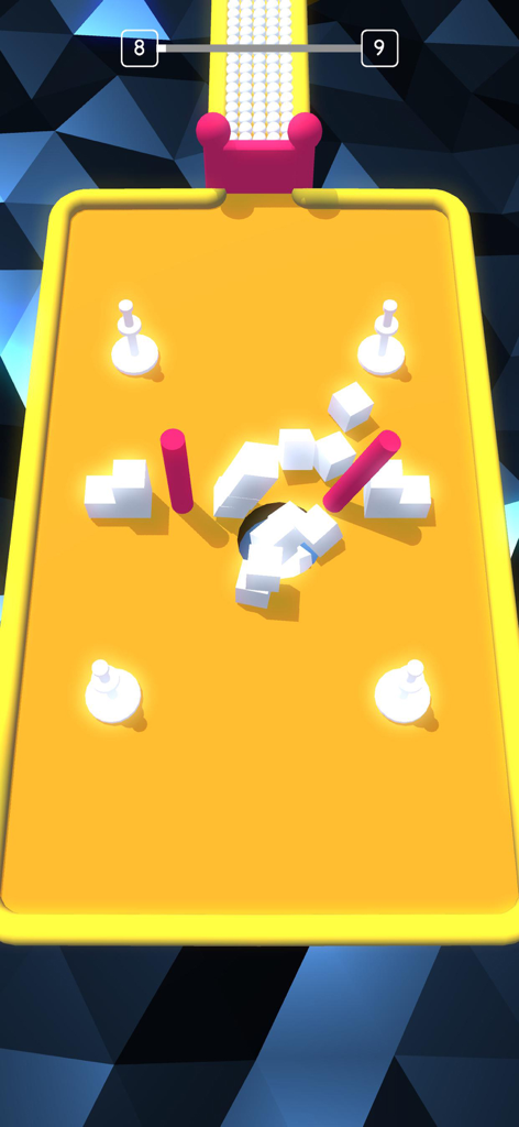 Un agujero negro tragando bloques 3D blancos en un tablero amarillo en el juego Color Hole