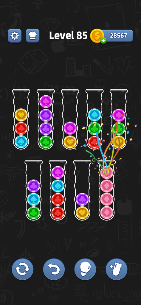 Mobile game screen of Ball Sort showing colorful poker chips in glass tubes on level 85