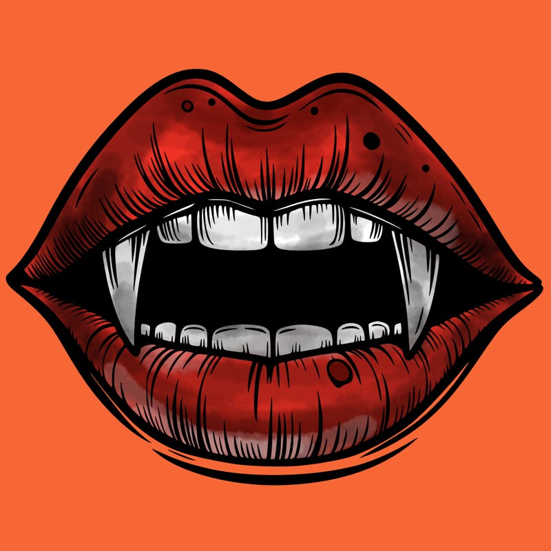 lips with vampire teeth