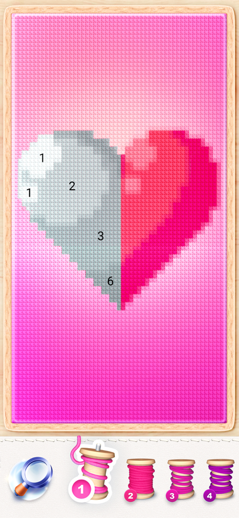 Heart pixel art being colored by number in the Magic Cross-Stitch app