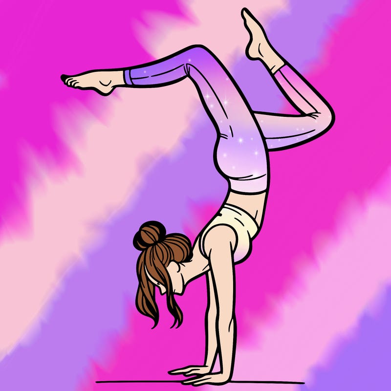 a woman doing a handstand