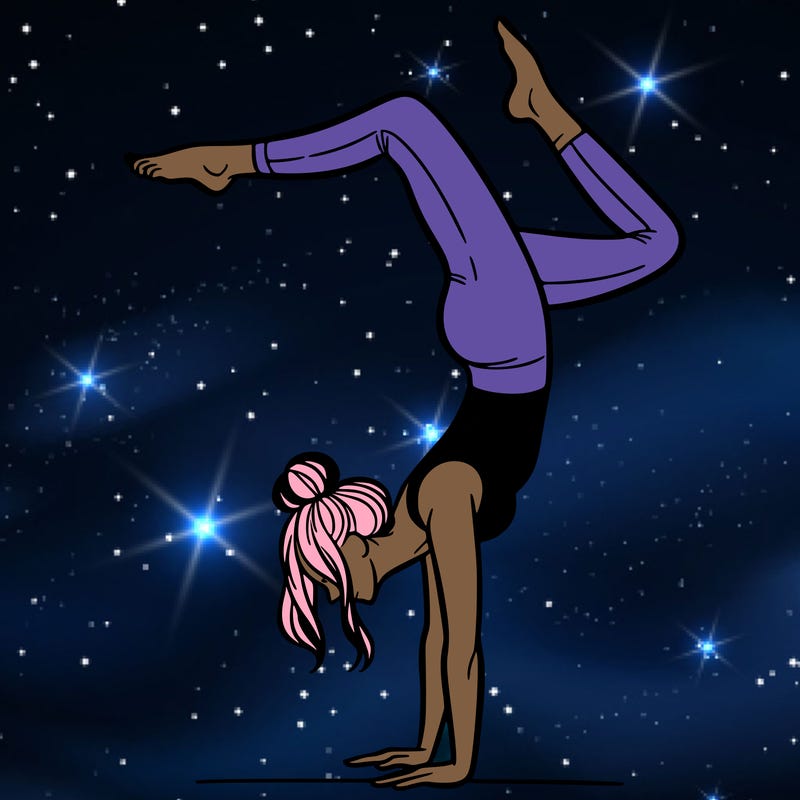 a woman doing a handstand