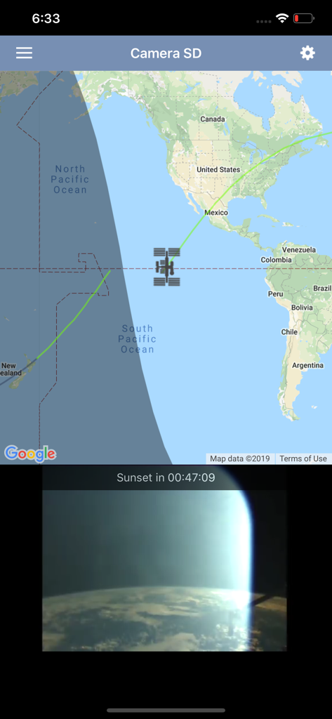 ISS Live Now - ISS Live Now app interface displaying a real-time orbit tracker map and a live video stream of Earth from space