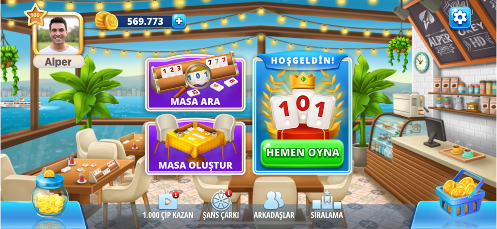 101 Okey Online HD Yüzbir - Main menu interface of the 101 Okey Online HD mobile game featuring a seaside cafe background and game navigation buttons