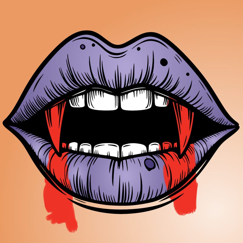 lips with vampire teeth