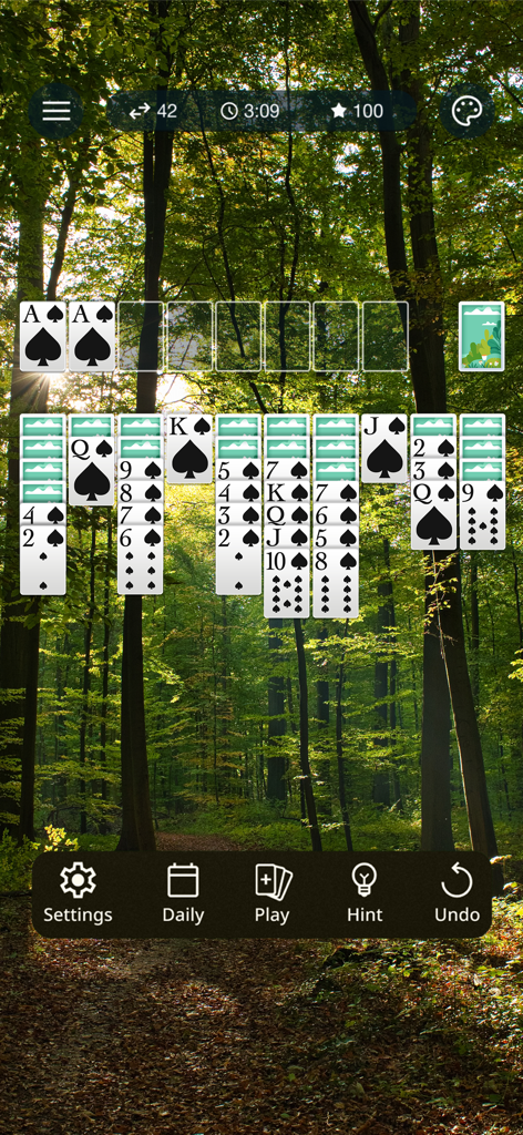 Spider Solitaire: Classic Card - Spider Solitaire classic card game gameplay with a peaceful forest background
