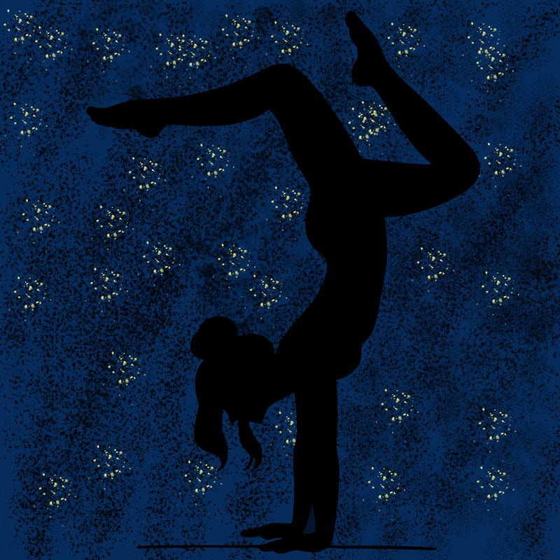 a woman doing a handstand