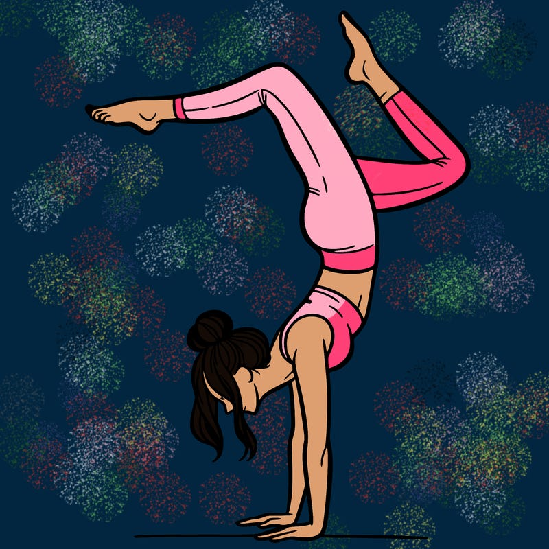 a woman doing a handstand