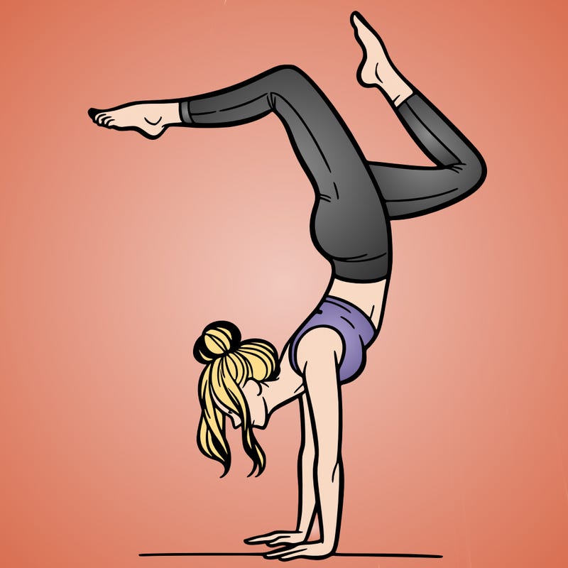 a woman doing a handstand