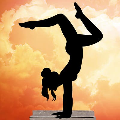 a woman doing a handstand