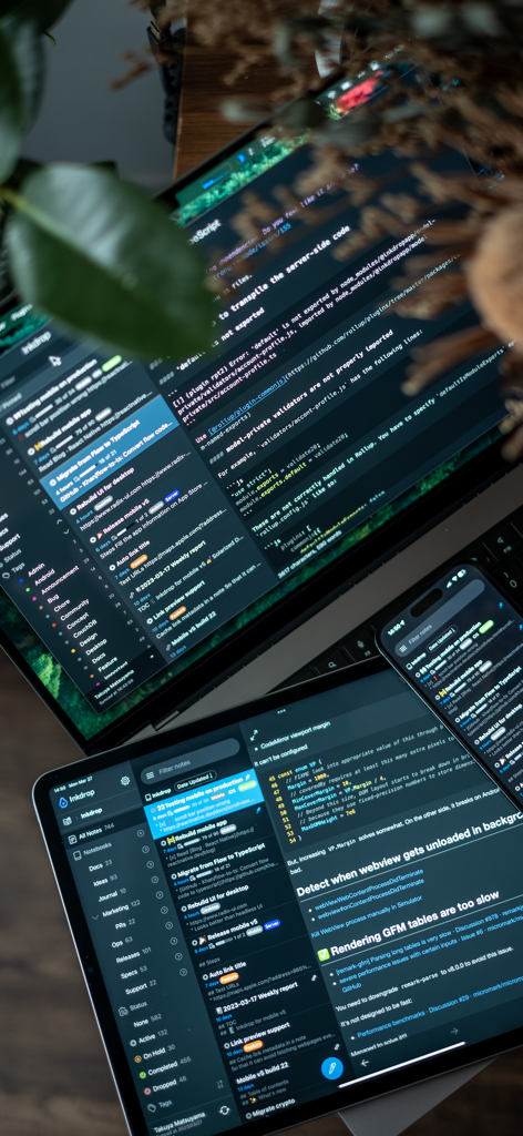 Inkdrop app displaying markdown notes and code syntax highlighting on a laptop, tablet and smartphone simultaneously.