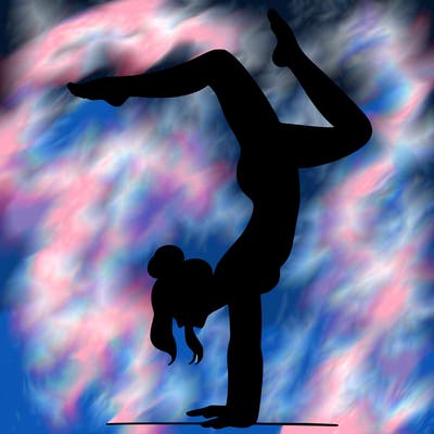 a woman doing a handstand