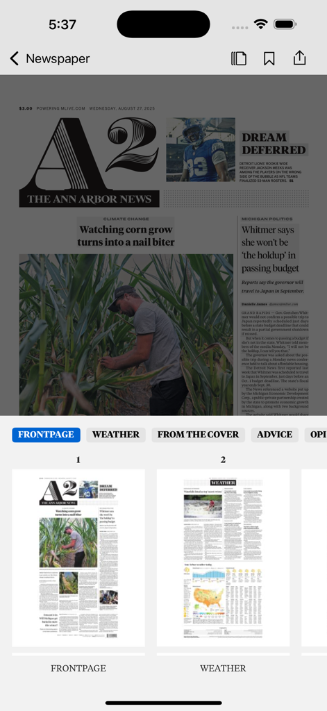 The Ann Arbor News mobile app interface showing a digital replica of the newspaper front page and navigation sections