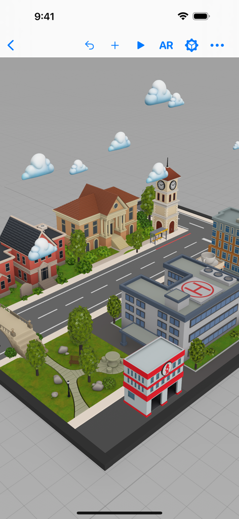 Reality Composer interface showing a stylized 3D town prototype with buildings and clouds