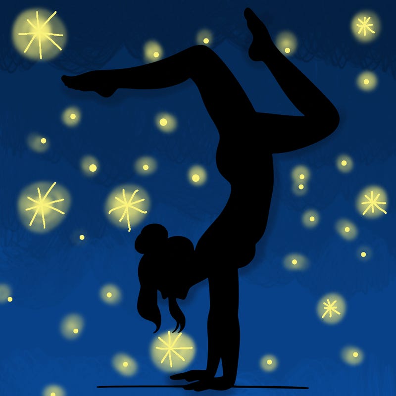 a woman doing a handstand