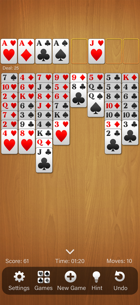FreeCell Solitaire (Classic) - Gameplay screen of FreeCell Solitaire Classic featuring clear cards and a wooden table background