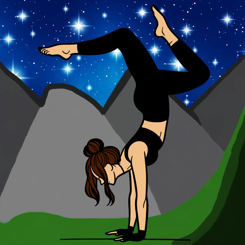 a woman doing a handstand