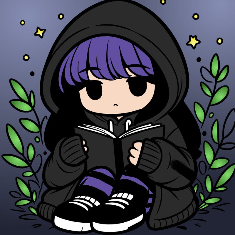 girl in oversized hoodie reading a book