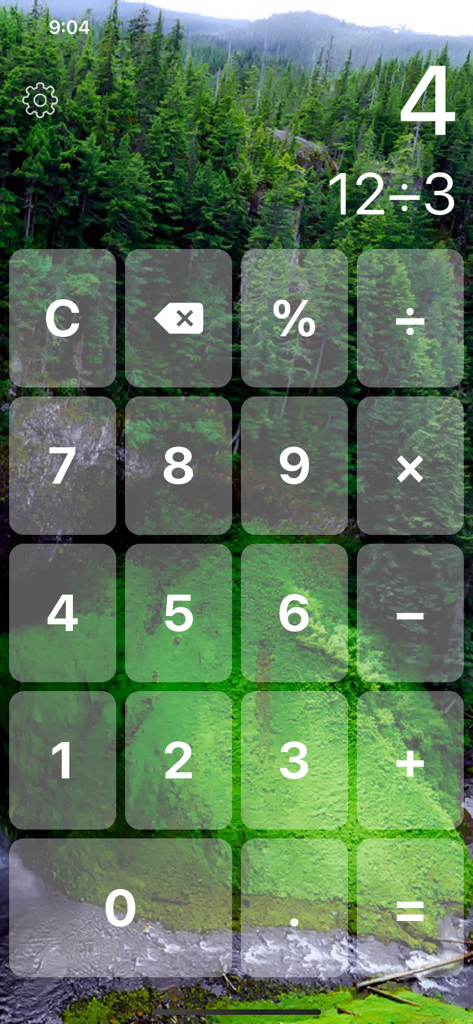 Big Button Calculator Pro Lite - Big Button Calculator app interface featuring large translucent buttons and a dual-line display over a scenic green forest background.